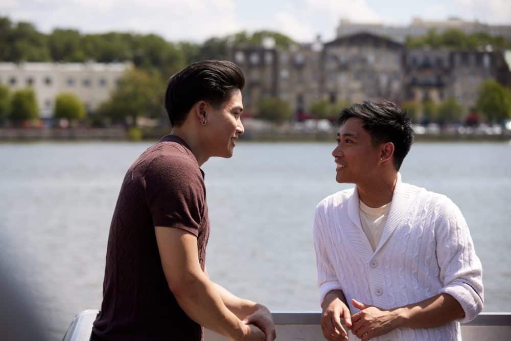 Two friends talking on a ferry