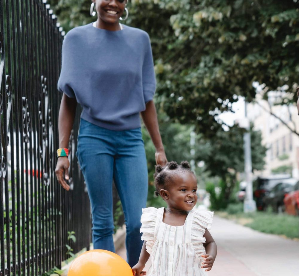 Image of family walking through park