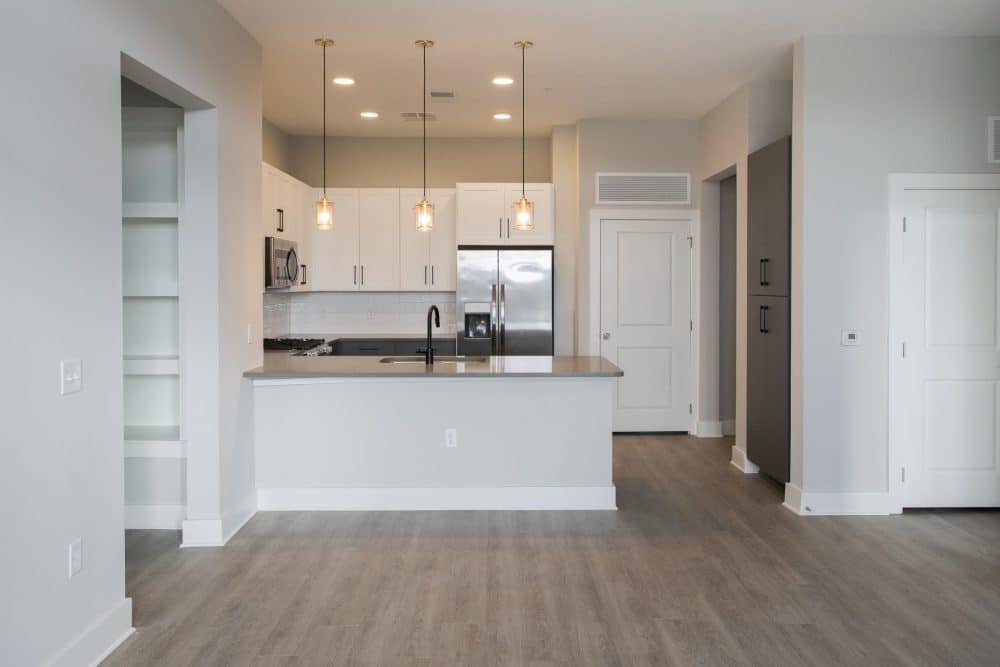 Interior apartment kitchen with stainless steel appliances