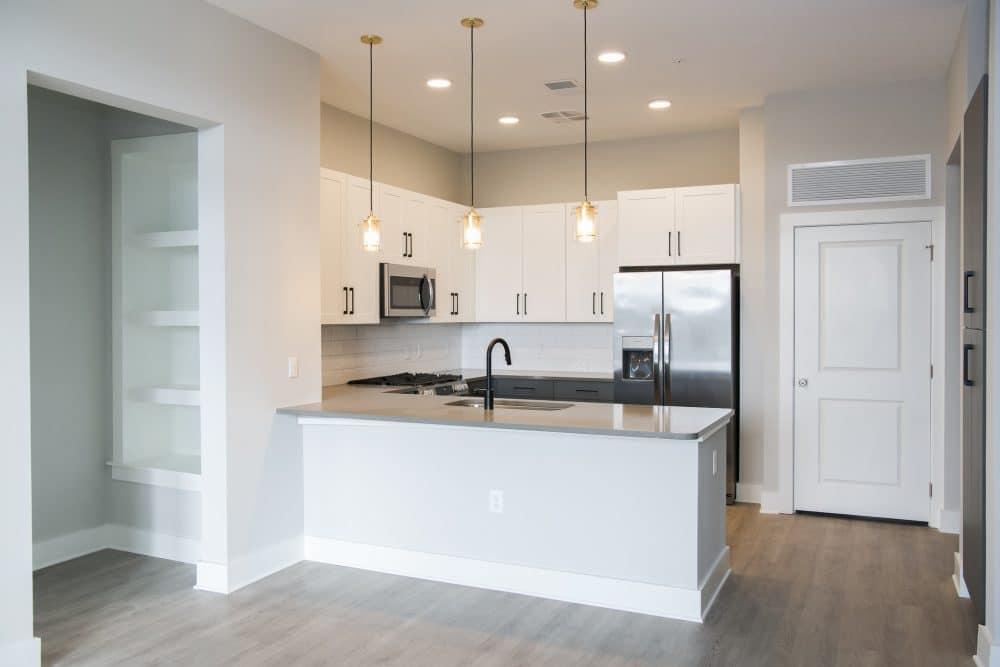 Interior apartment kitchen with stainless steel appliances